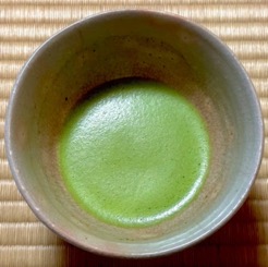 Usucha: A bowl of thin tea, which is light green and frothy, in the style of the Urasenke school of tea.